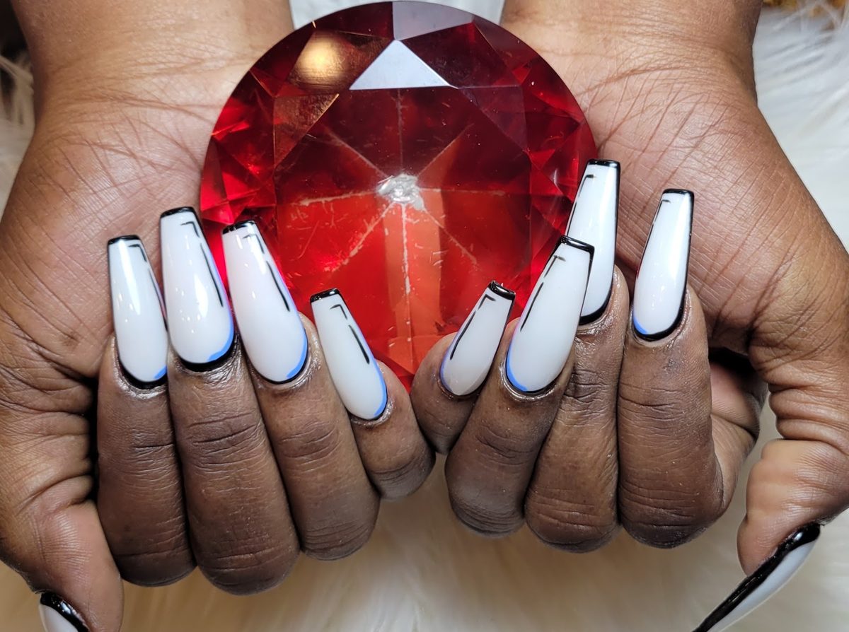 Long white coffin nails with fine black outlines