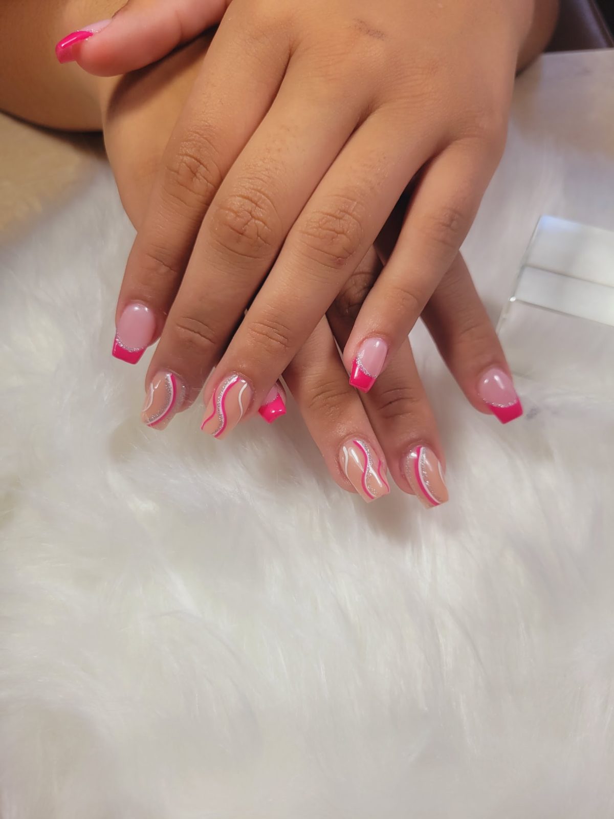 Pink square French tips with white glitter swirls