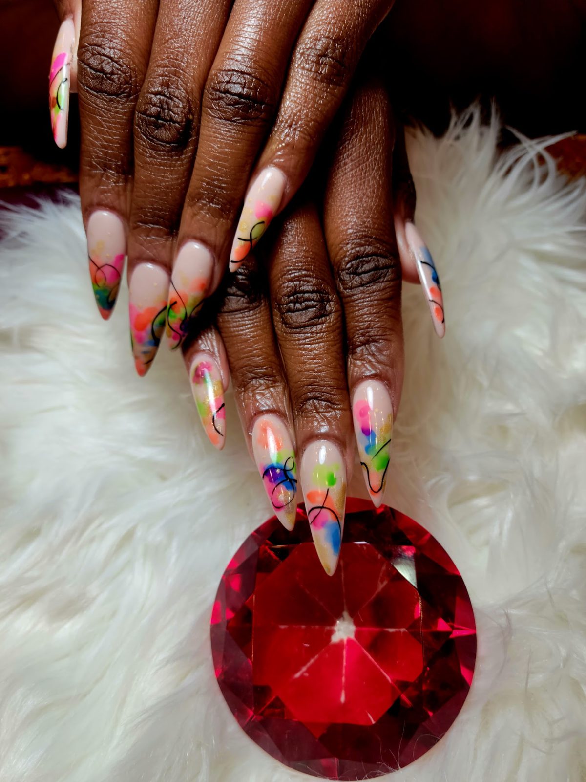 Long almond nails with colorful abstract art