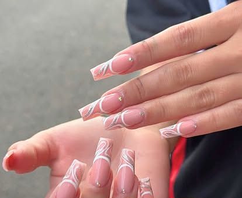 Long square French tips with white swirl detailing and tiny rhinestones — Hybrid Gel full set at Viva Nail Spa